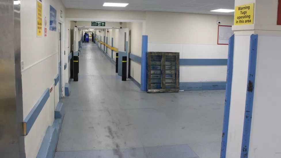 A corridor in a poor state of repair