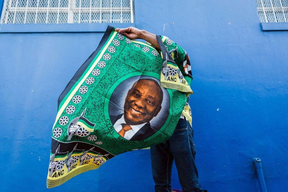 A street vendor sells goods depicting South African President Cyril Ramaphosa on 12 January 2019.