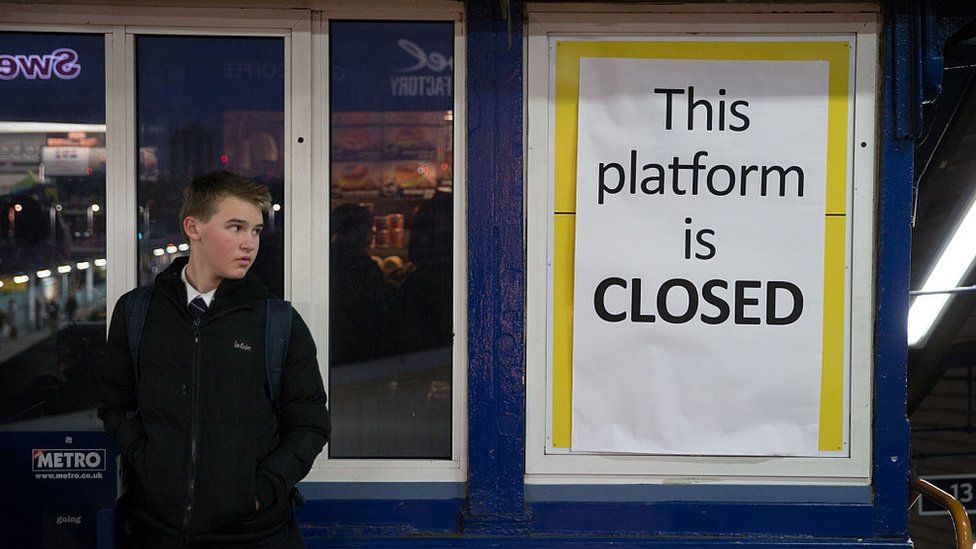 Man looking at closed sign