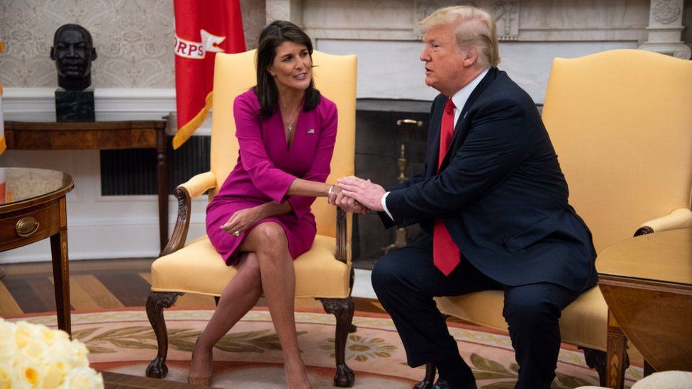 Nikki Haley, United States Ambassador to the United Nations, shakes hands with President Donald Trump after she announced her plan to resign at the end of the year in the Oval Office of the White House on October 9, 2018 in Washington, DC