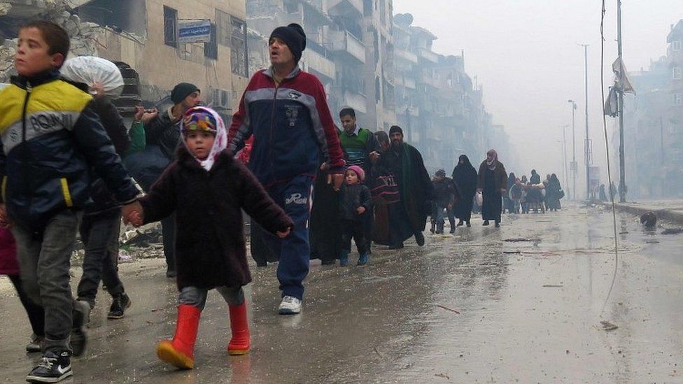 Syrian residents flee violence in eastern Aleppo on 13 December 2016