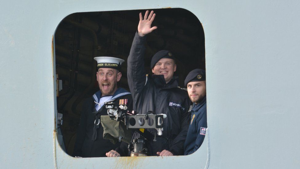 Sailors on the HMS Queen Elizabeth waved to the crowds