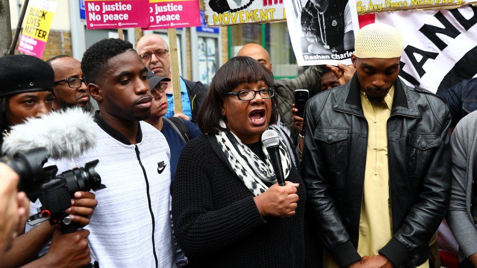 Shadow Home Secretary, Diane Abbott speaks at a protest outside Stoke Newington police station over the death of Rashan Charles,