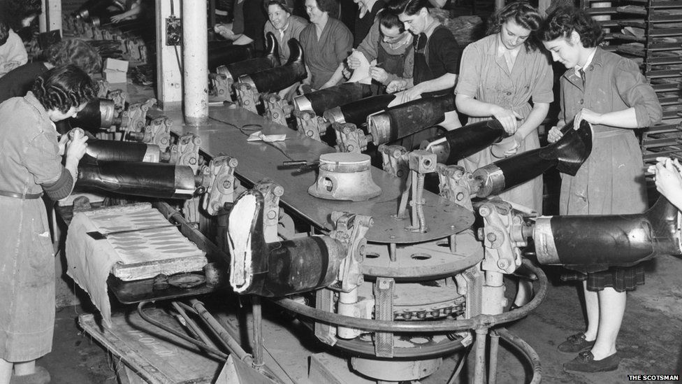 Production line workers making wellington boots at the North British Rubber Company in Edinburgh