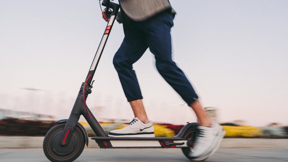 Man on electric scooter