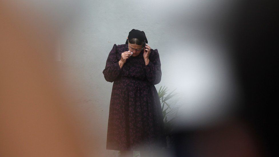 The mother of Mennonite farmer Abraham Fehr, who was kidnapped by the Paraguayan People's Army (EPP) guerrilla in 2015 and presumably killed that same year, is seen outside the morgue in Asuncion on January 12, 2018 after his remains were found in a common grave in northern Paraguay