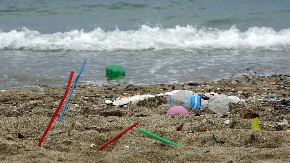 Plastic rubbish lies on the Aegean sea beach near Athens