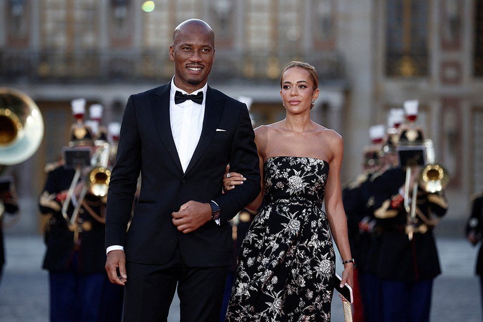 Didier Drogba and Gabrielle Lemaire arrive to attend the state dinner