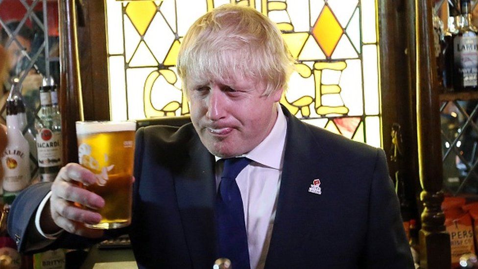 Prime Minister Boris Johnson with a pint