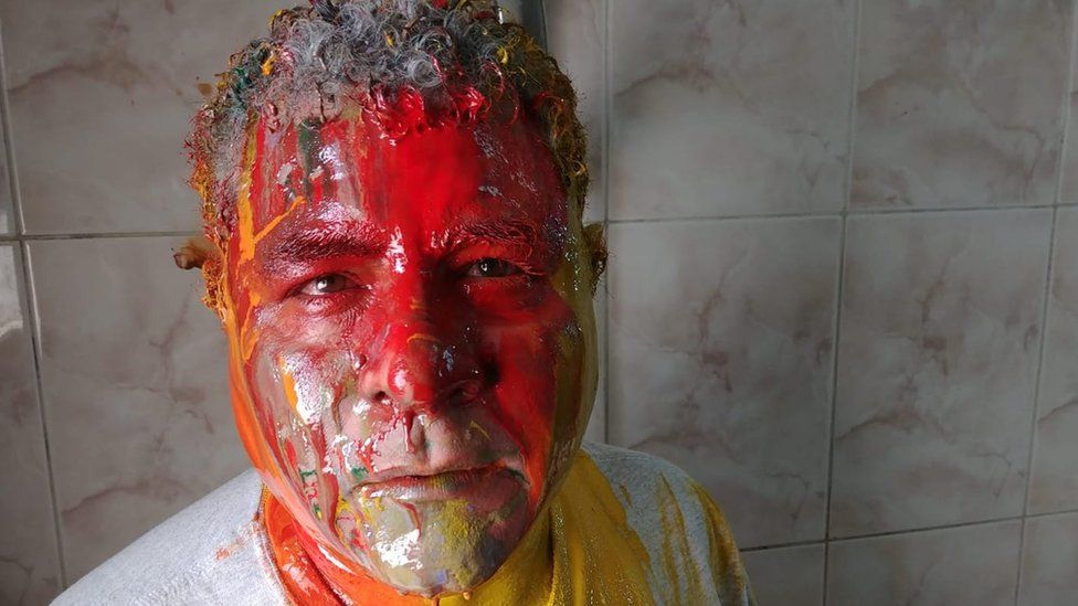 A picture of Egyptian human rights lawyer Gamal Eid covered in paint