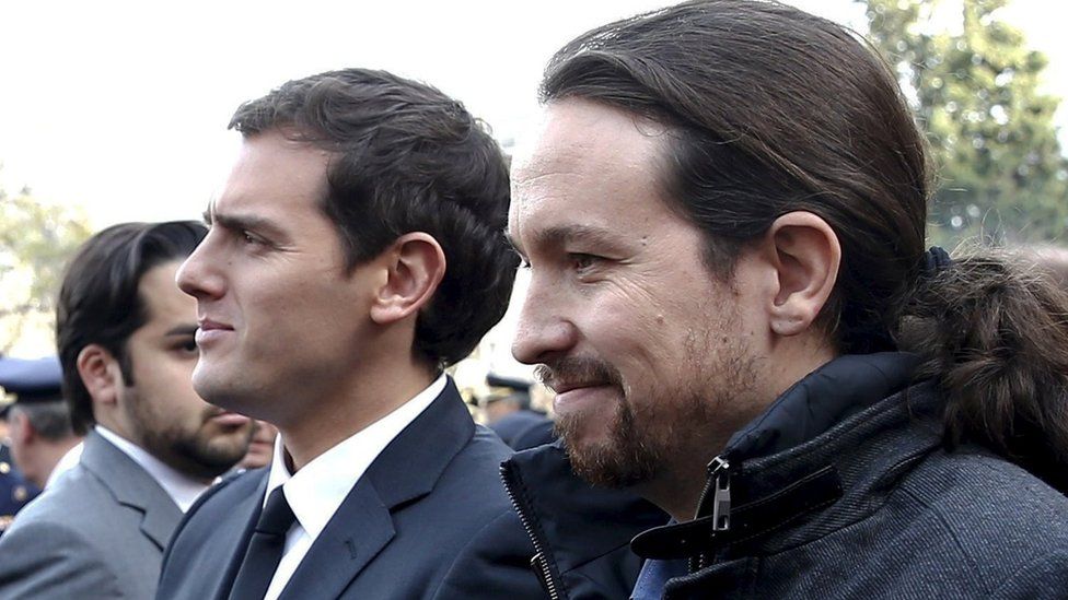 Citizens leader Albert Rivera (L) and Podemos party leader Pablo Iglesias at a state funeral in Madrid, 15 December