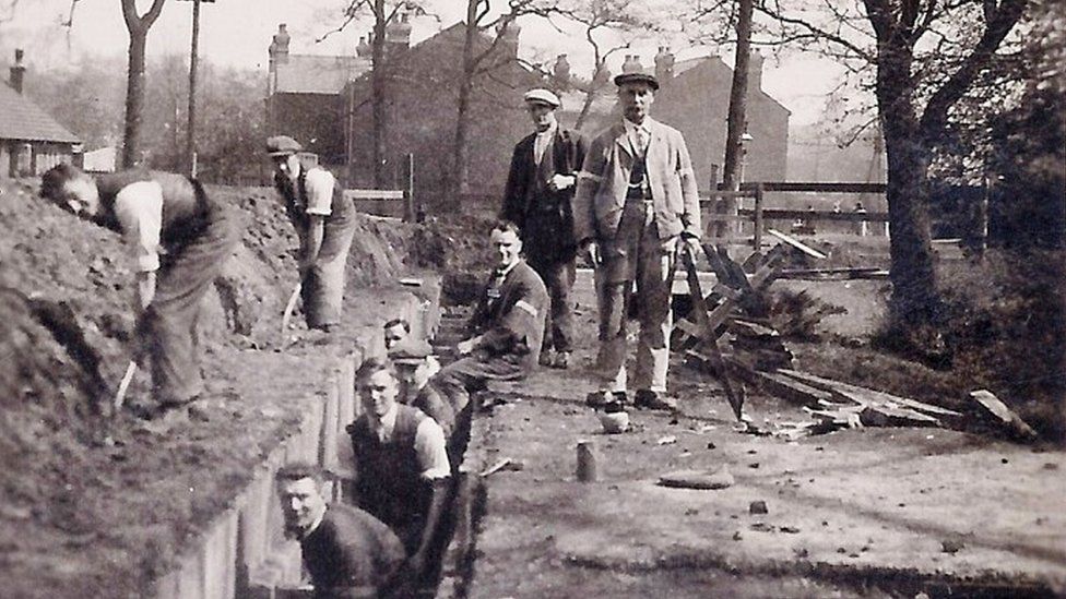 A group of men diverting Gallows Brook underground in 1919