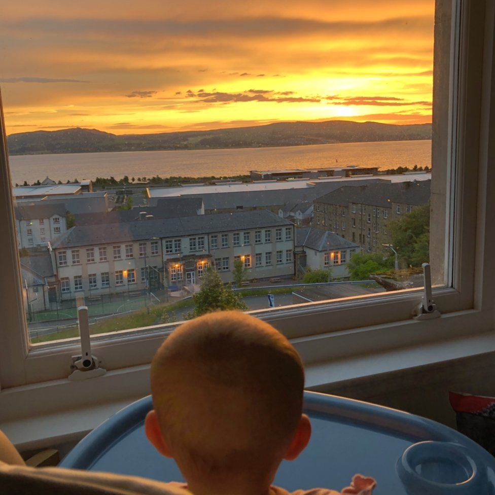 Baby looking at sunrise