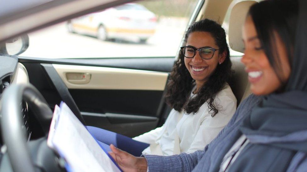 Student Maria al-Faraj with driving instructor Ahlam al-Somali