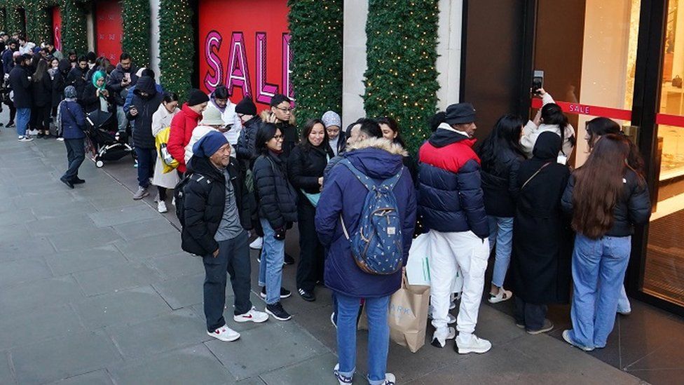 Shoppers queueing outside Selfridges on Boxing Day