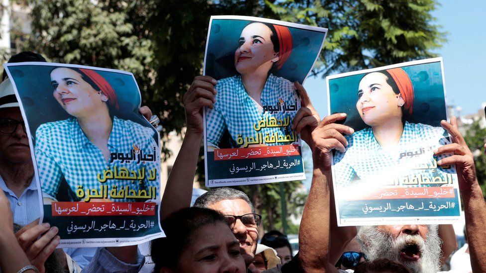 Moroccan activists hold posters of Hajar Raissouni at a protest outside the Rabat tribunal. File photo