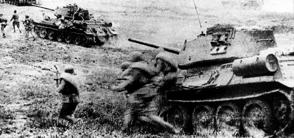 Soviet troops going into battle at Kursk with T-34s