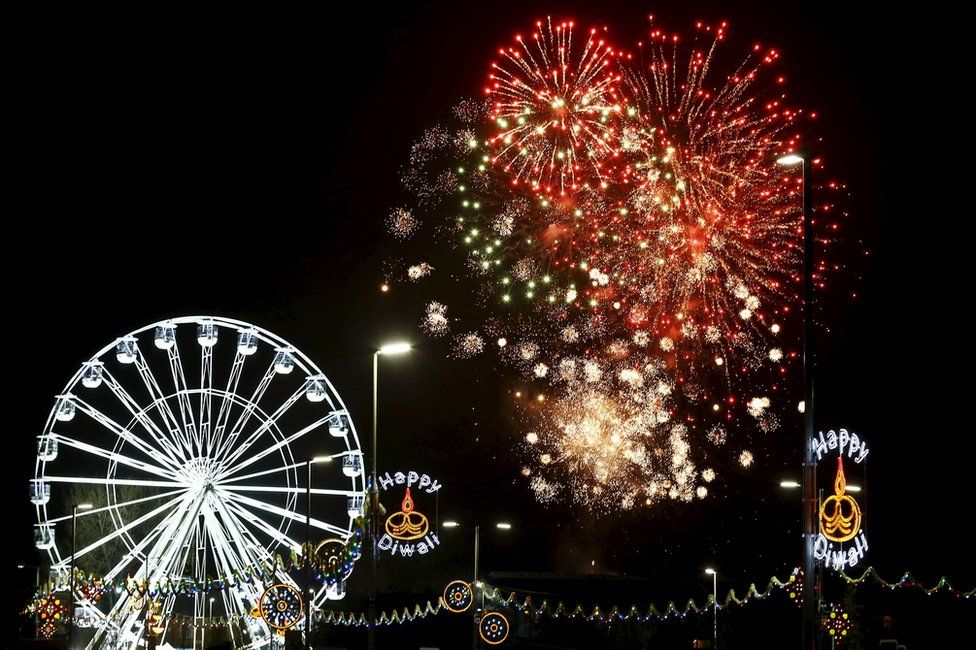 Fireworks explode near the Wheel of Light during Diwali celebrations in Leicester