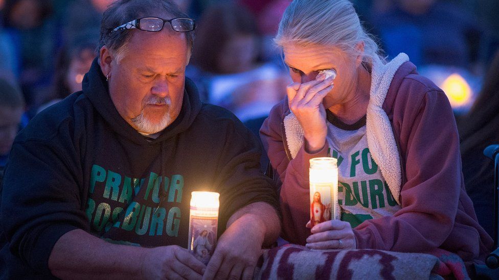 Roseburg residents attend a candlelight prayer vigil following the shootings.