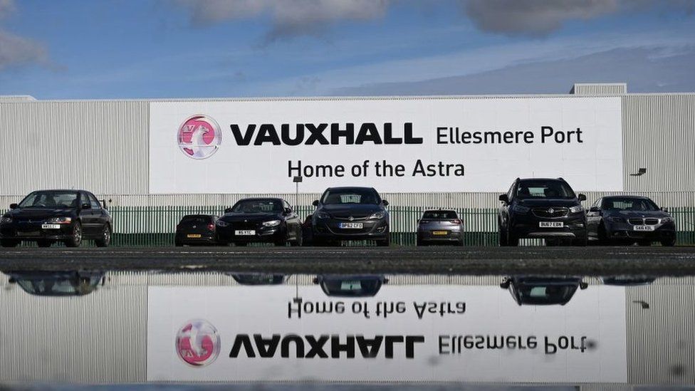 Vauxhall cars parked in front of Ellesmere Port plant.