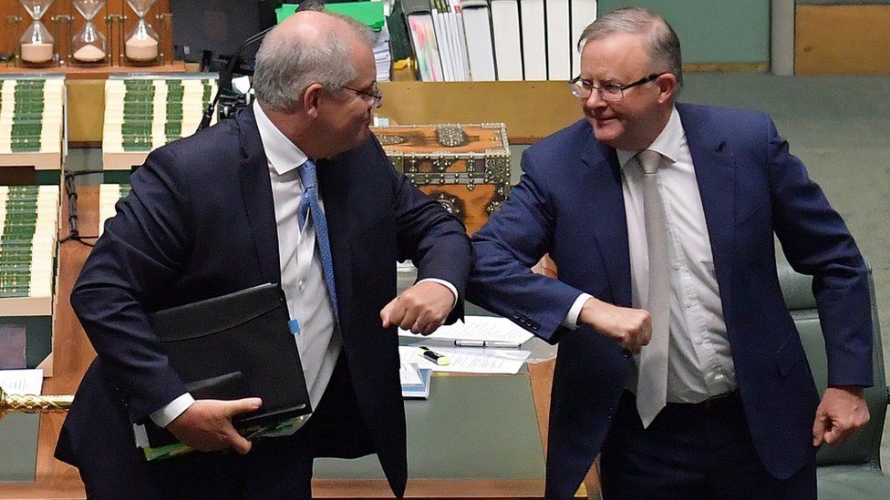 Scott Morrison and Anthony Albanese bump elbows in parliament