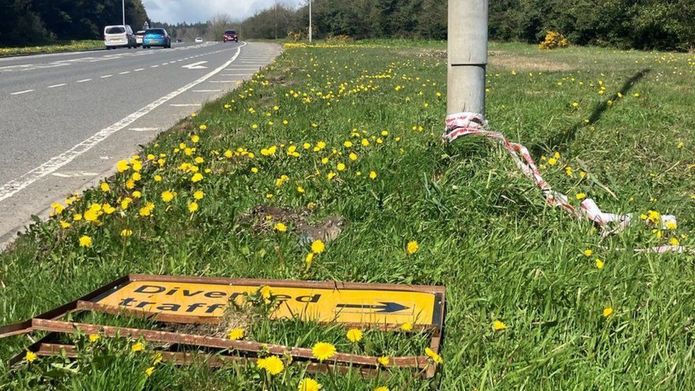 A diverted traffic sign near where the man's body was found