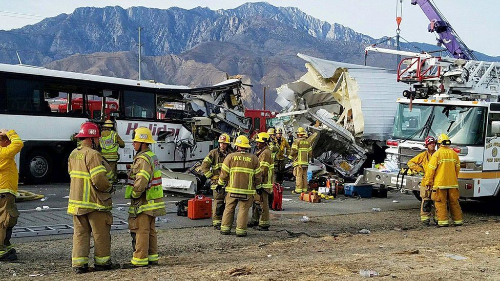 This photo provided by KMIR-TV shows the scene of crash between a tour bus and a semi-truck crashed on Interstate 10 near Desert Hot Springs, near Palm Springs, in California's Mojave Desert Sunday, Oct. 23, 2016.