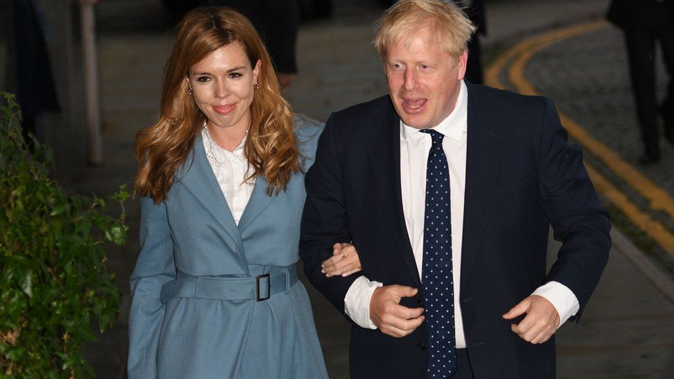 Boris Johnson and his partner Carrie Symonds arrive in Manchester