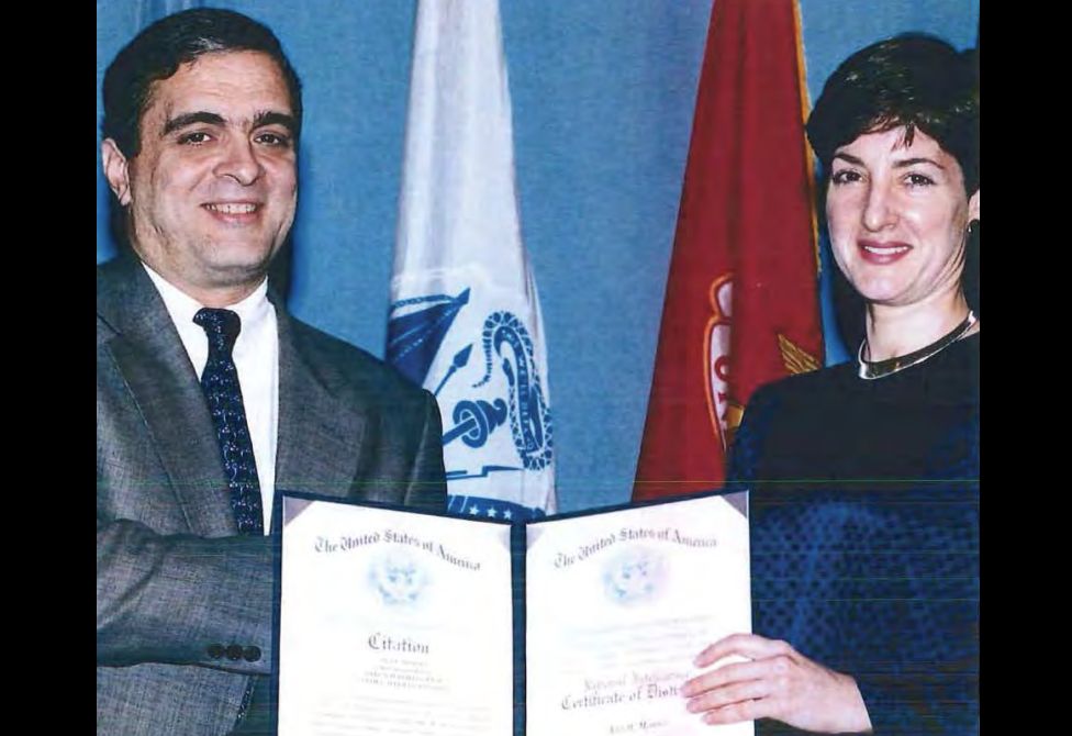 Montes receives a National Intelligence Certificate of Distinction from George Tenet of the CIA