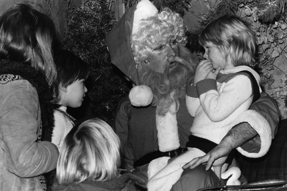 Children visit Santa in his grotto