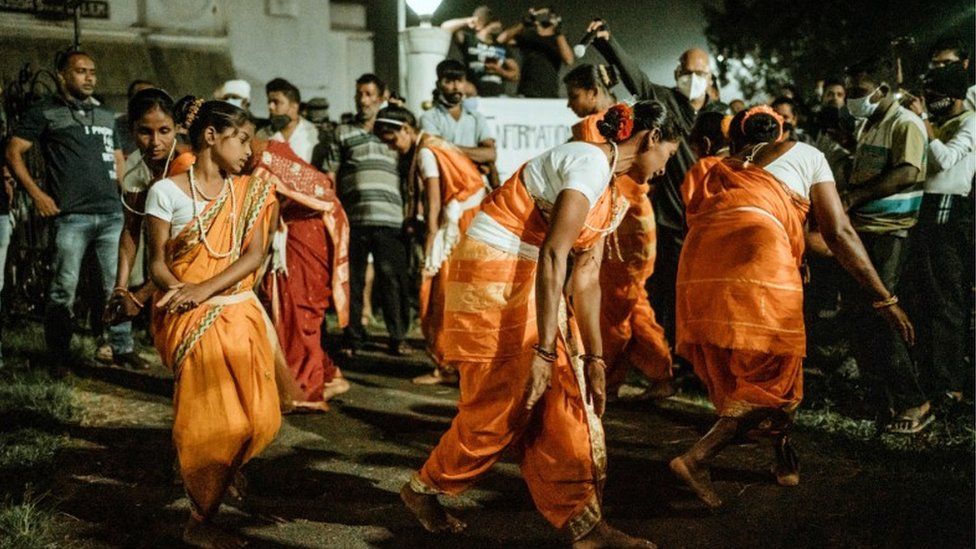 Protestors performing traditional dances