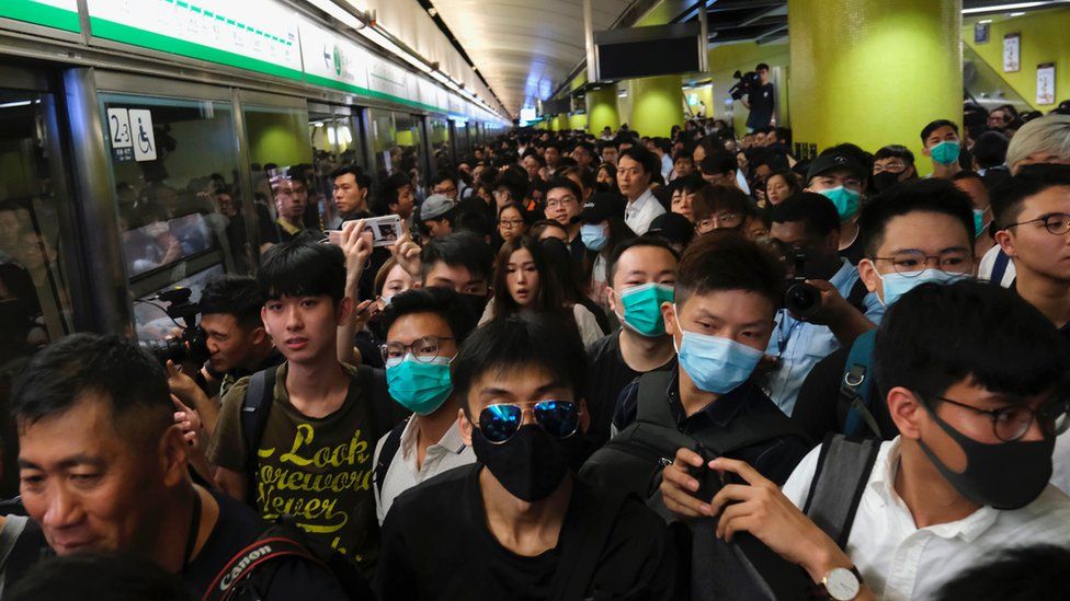 Train passengers queue as Anti-extradition bill protesters disrupt train services
