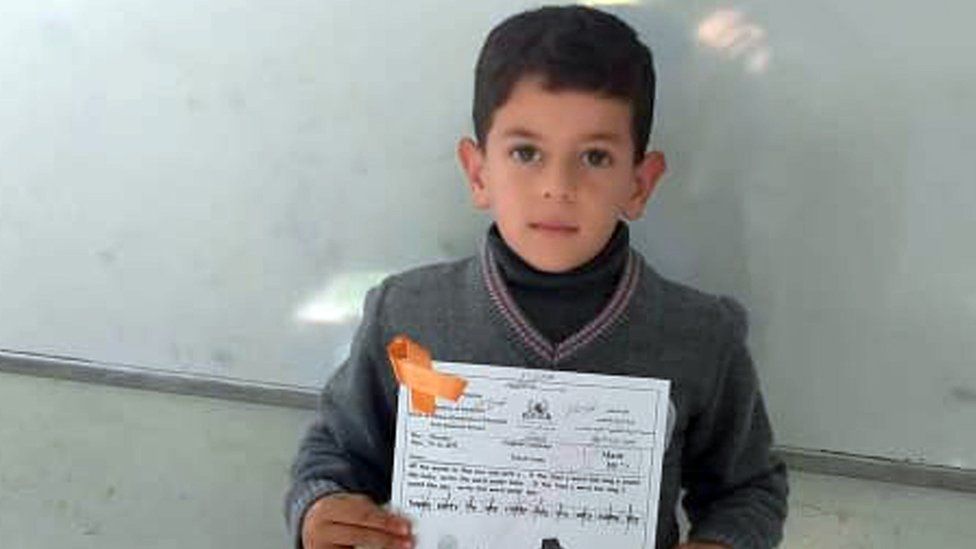 Amr is seen holding a worksheet