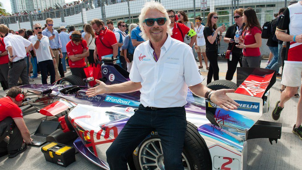 Richard Branson with a Formula E car