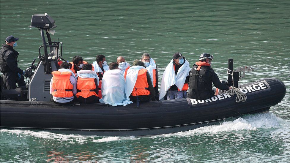Migrants on a Boarder Force boat