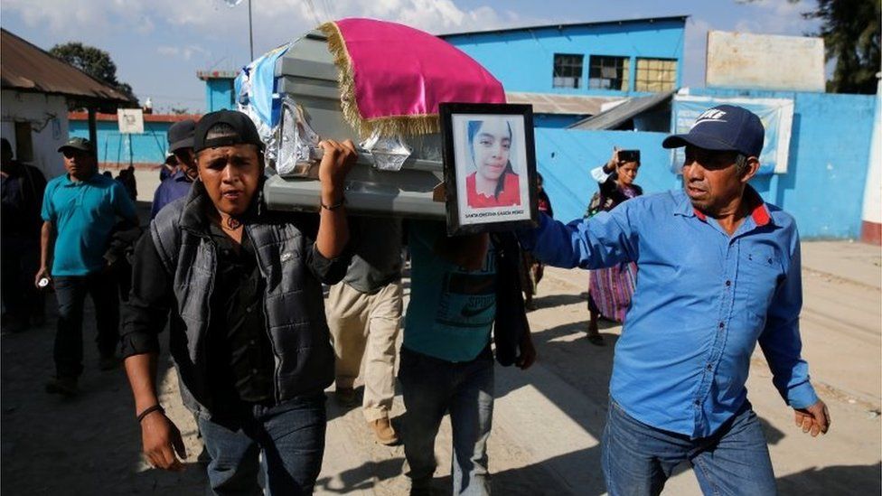 People carry the coffin with the body of Santa Cristina Garcia, a migrant killed in the Mexican state of Tamaulipas while trying to reach the U.S., during her funeral in Comitancillo, Guatemala, March 14, 2021.