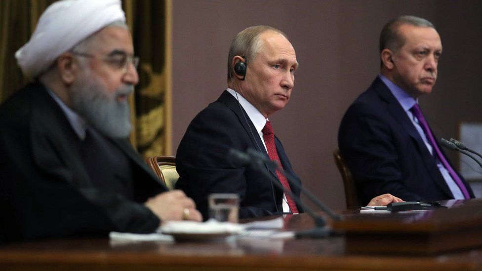 Russian President Vladimir Putin flanked by Iranian President Hassan Rouhani (L) and Turkish President Recep Tayyip Erdogan (R) in Sochi, Russia, 22 November 2017