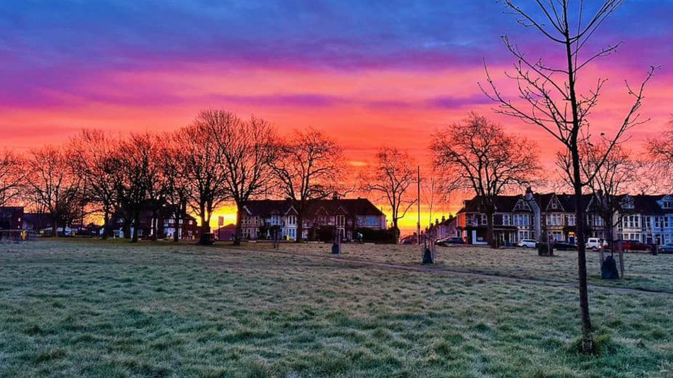 Sunrise above houses and a green space in Southmead, Bristol