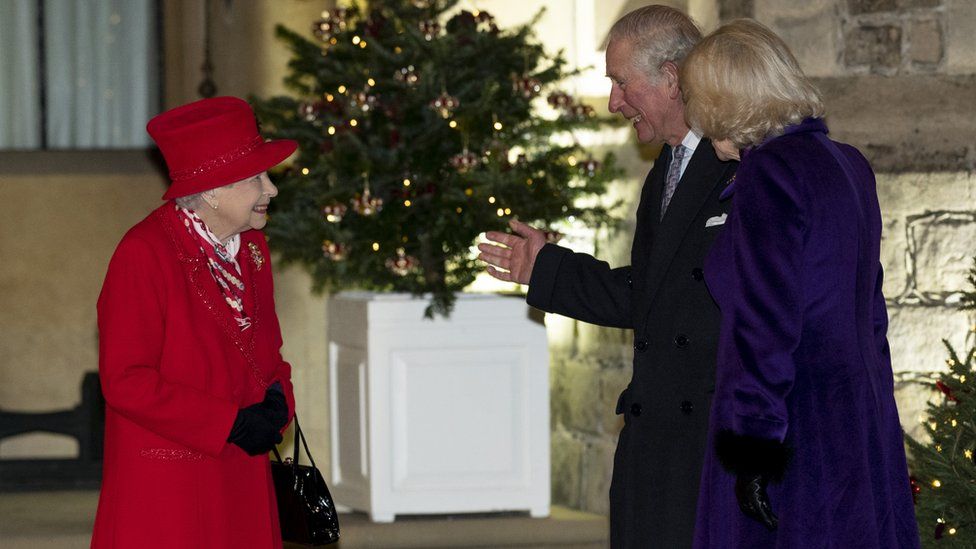 The Queen speaks to Prince Charles and Camilla