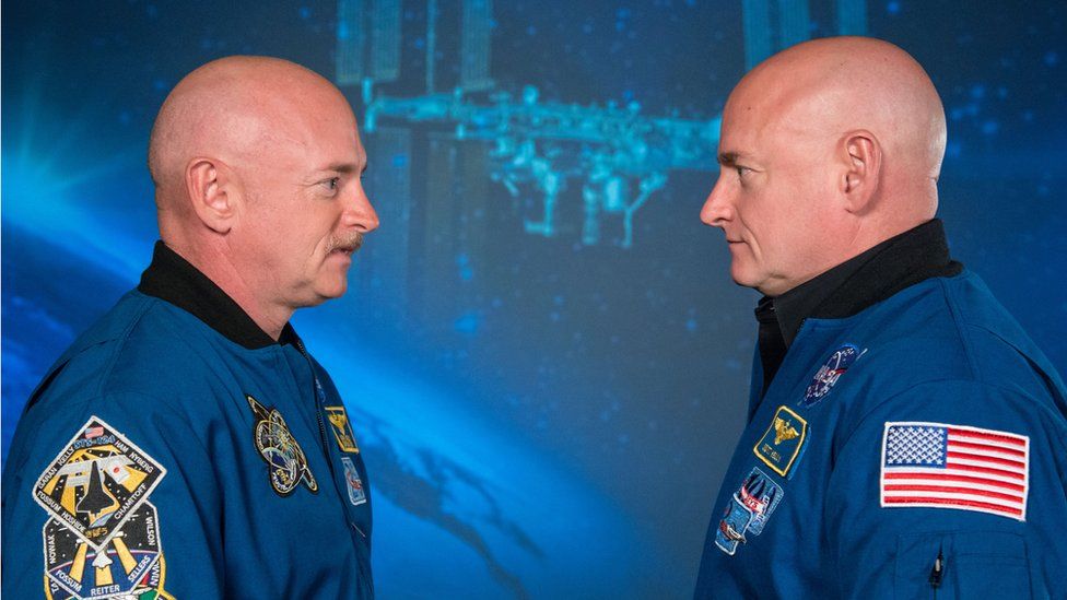 Scott and Mark Kelly looking at each other