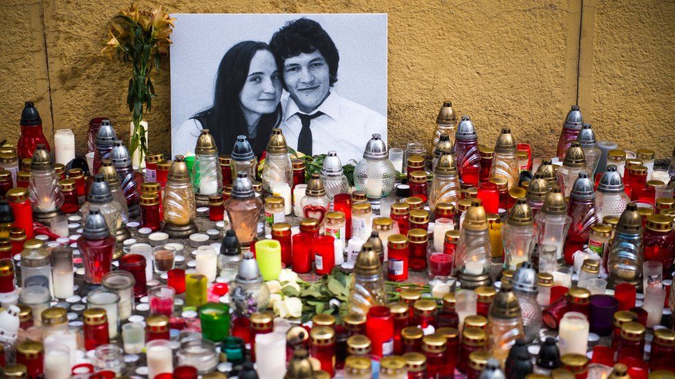 Hundreds of candles have been placed in front of a portrait of Slovak investigative journalist Jan Kuciak and his girlfriend Martina Kusnirova