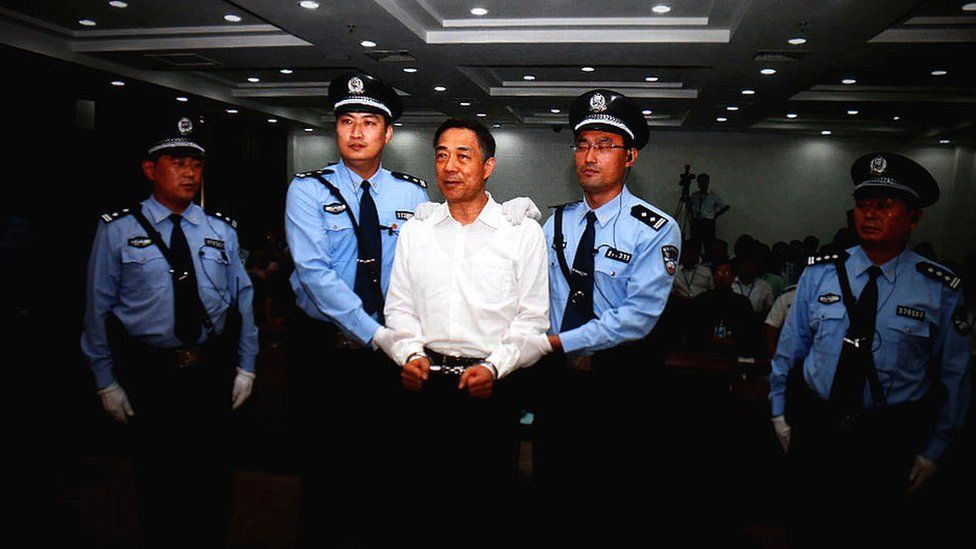 A screen shows the picture of the sentence of Chinese politician Bo Xilai (Center) on September 22, 2013 in Beijing, China.