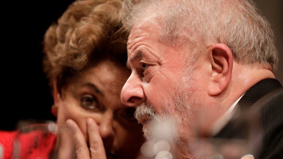 Former Brazilian President Luiz Inacio Lula da Silva speaks with former Brazilian President Dilma Rousseff during the inauguration of the new National Directory of the Workers" Party, in Brasilia, Brazil July 5, 2017