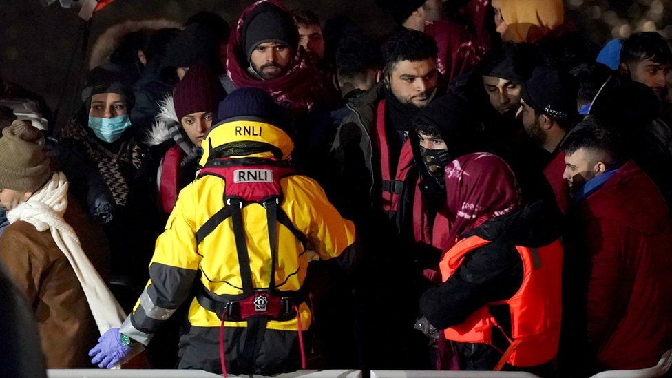 A group of migrants on board the Dover lifeboat, after being rescued in the Channel.