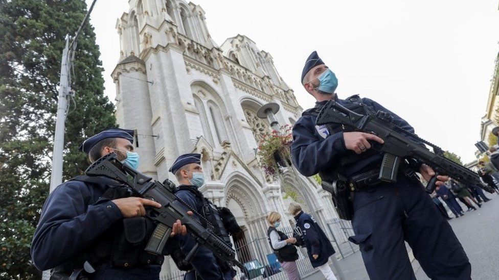 Armed French police guard outside the Notre-Dame basilica in Nice, France. Photo: 29 October 2020