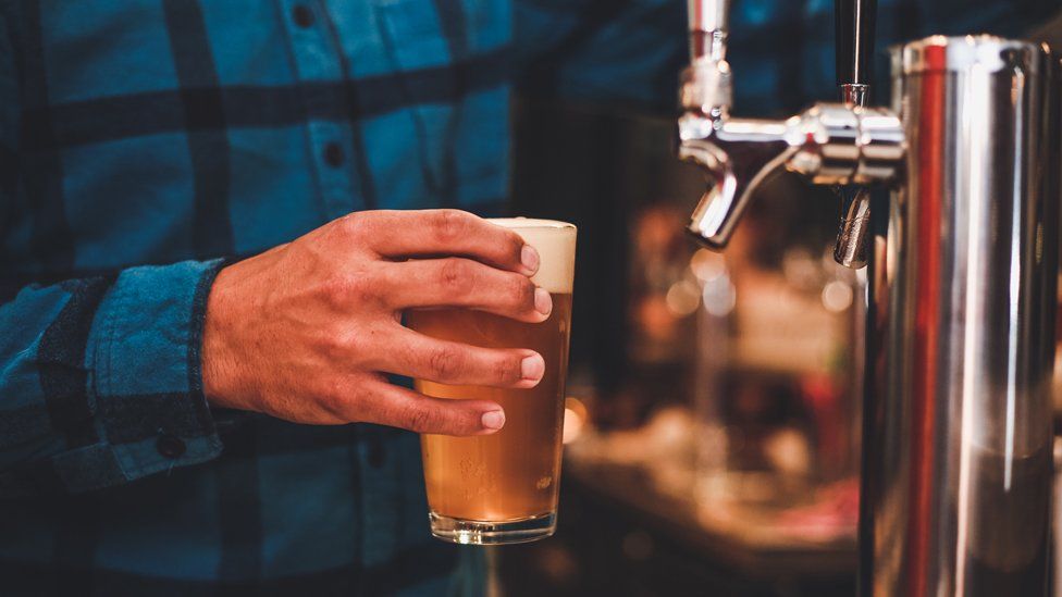 Man pouring a beer