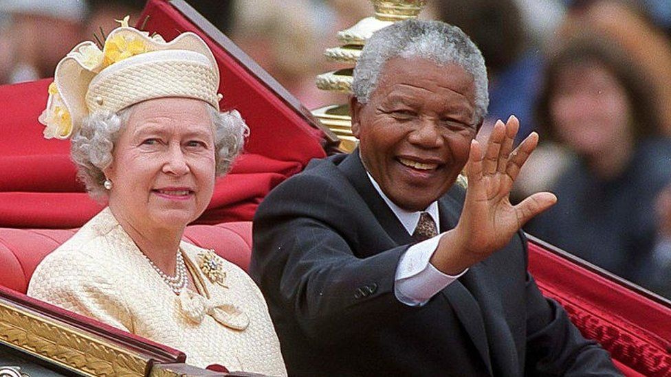 President Nelson Mandela of South Africa, with Queen Elizabeth II, taking a carriage ride along the Mall to Buckingham Palace during a State Visit to the UK on July 9, 1996 in London, England