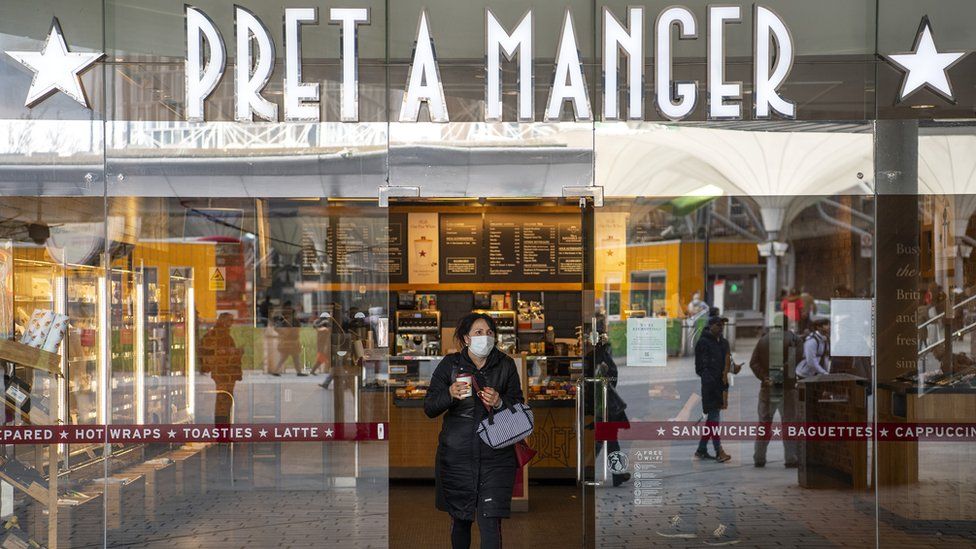 A customer walks out of Pret A Manger in London