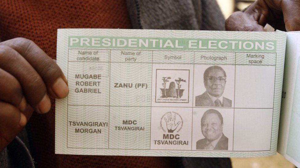 A Zimbabwean shows his ballot for the presidential election run-off at a polling station in Harare on June 27, 2008.