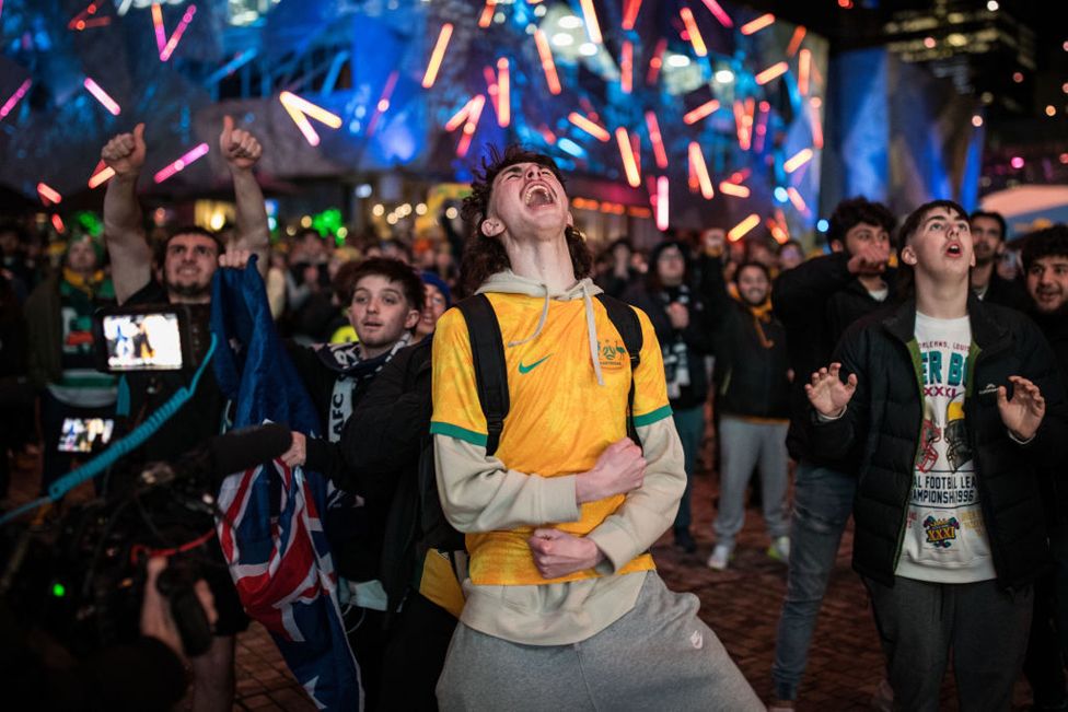 Australian fans celebrate their teams win as they watch the opening FIFA Women's World Cup Australia & New Zealand 2023 Group B match between Australia and Ireland at Federation Square on July 20, 2023 in Melbourne, Australia.